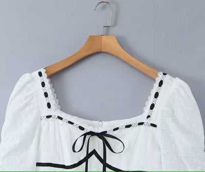 (PRE-ORDER: ETA August 5,2024)Mireil White Eyelet Square Neck with Black Ribbon Short Sleeves Layered Mini Dress